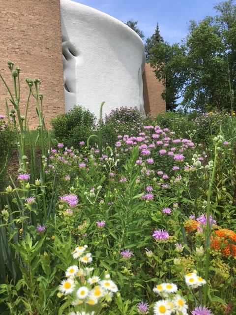 Photograph of church exterior with flowers